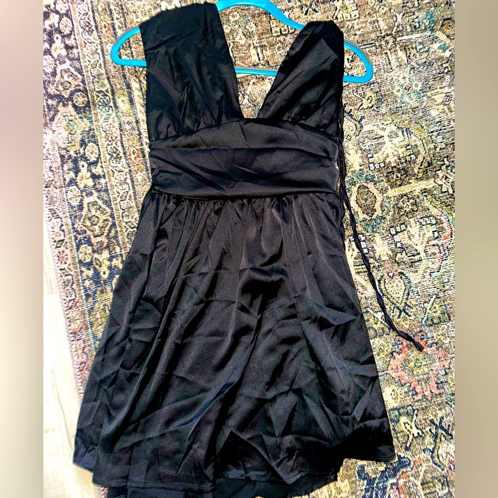 NWT romper, satin silky material with adjustable back tie.